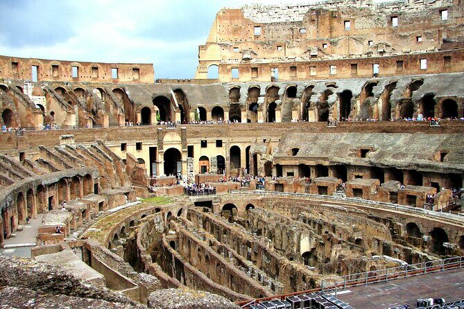 Imperial Rome Including Colosseum with Roman Forum and Palatine Hill Tour - Colosseum: Flavian Amphitheatre in sand, concrete, and brutal spectacle