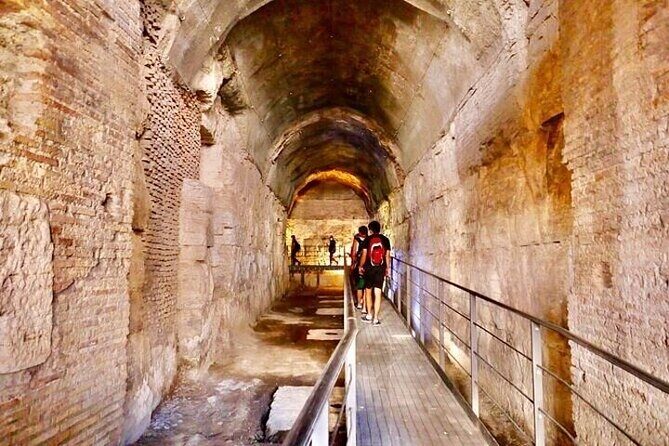 Rome: Colosseum Tour by Night with Arena & Underground - The Arena Floor: Feeling the Scale Up Close